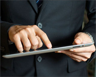 Hands operating a tablet computer